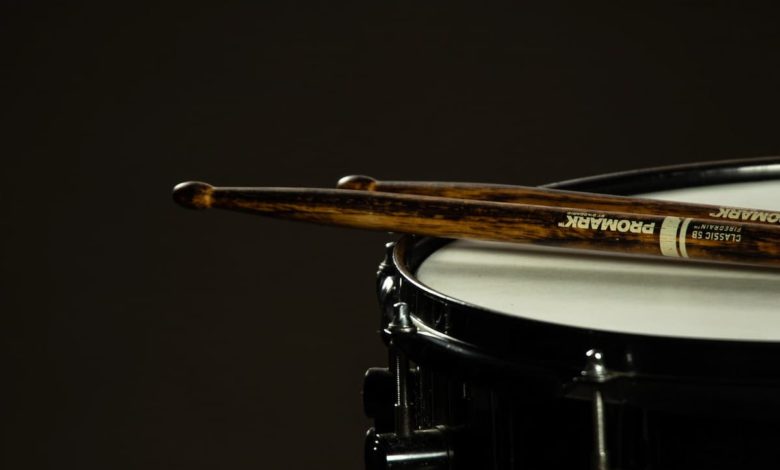 Promark drum sticks resting on a snare drum