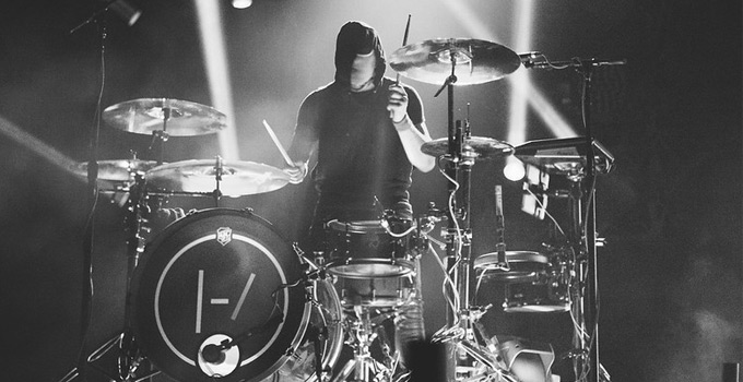 Josh Dun of twenty one pilots playing an SJC custom drum set on stage in 2014