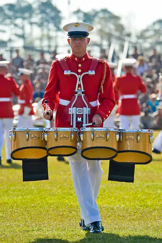 Man playing marching tenor drums