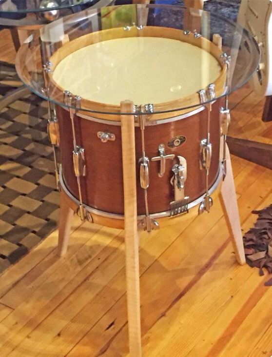 Glass top table made from an old marching snare drum