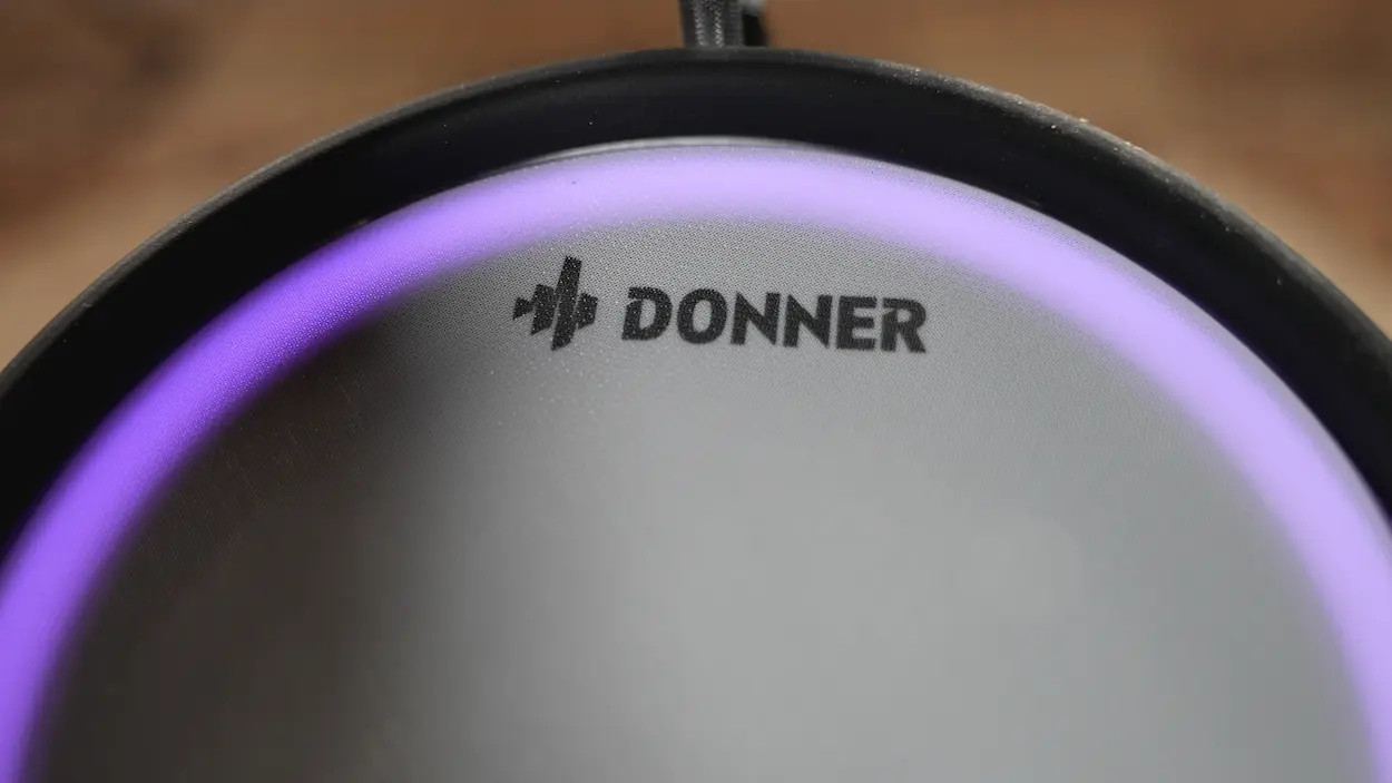 Donner BackBeat logo on the illuminated mesh drum head