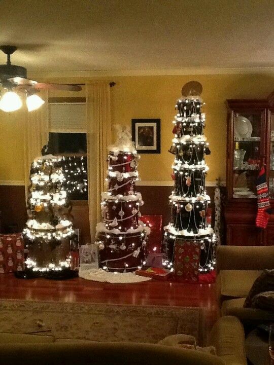 Three Christmas trees made from stacked drums