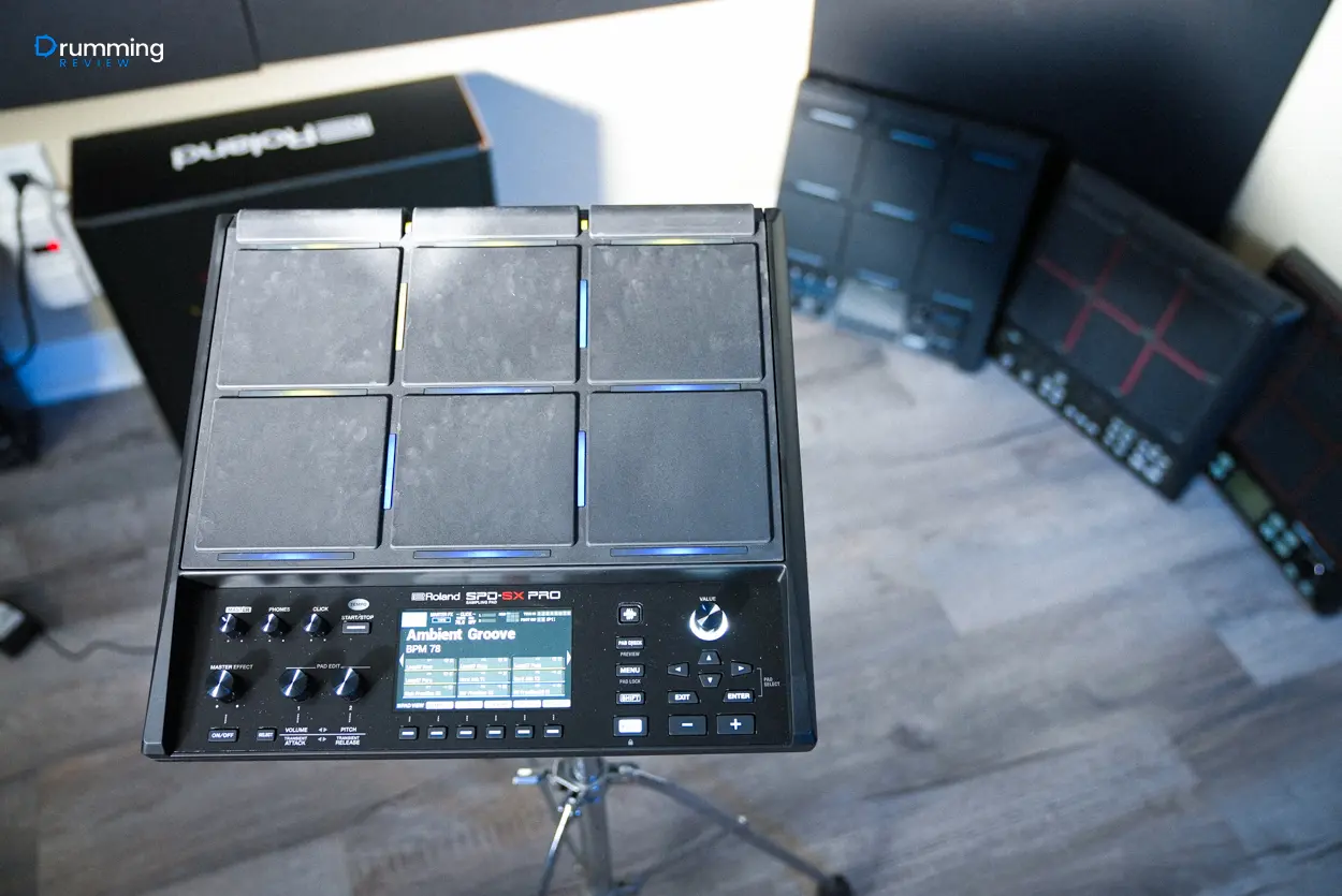 A photo of a Roland SPD-SX PRO with various other sampling pads in the background of the shot